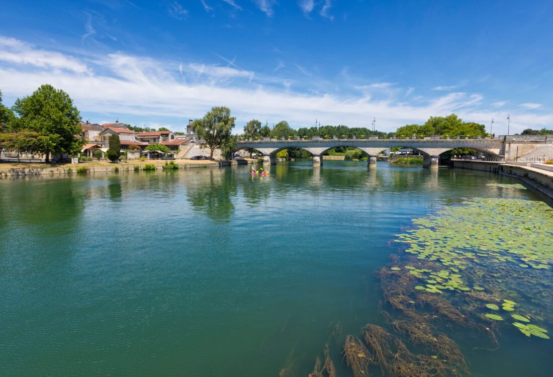 Charente river with Pont Neuf bridge at Cognac, France